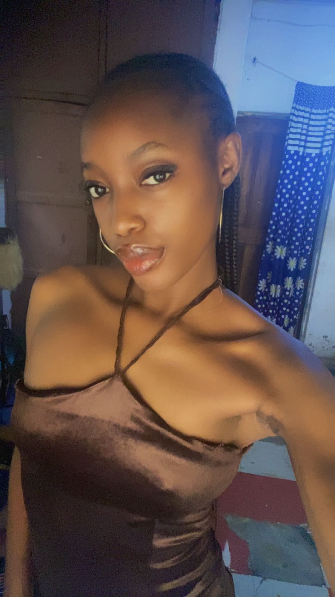 A woman from Nigeria in a satin halter dress, one of the people you meet on CamlooCam